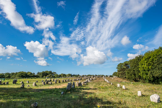 The standing stones of Carnac, France feature in many travel stories, from travel mishaps to magic. Image © Arie Mastenbroek/Thinkstock