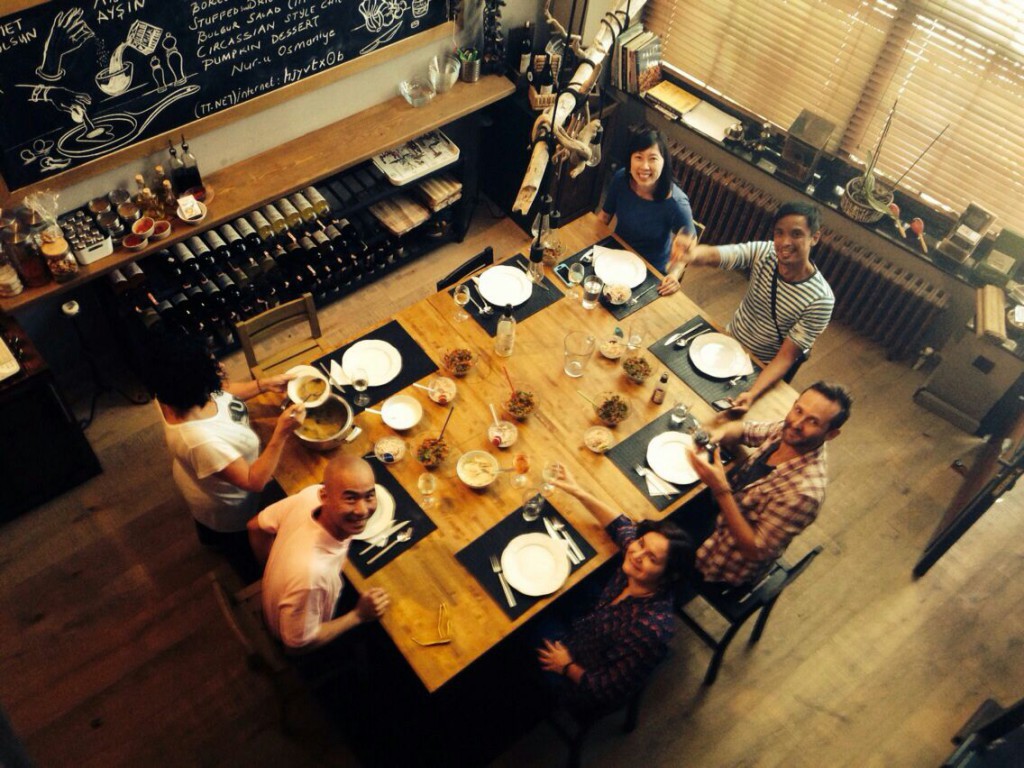 Students at Cookistan, a culinary school in Istanbul, Turkey, celebrate the art of solo travel by sharing a meal they have prepared together. Image © Cookistan