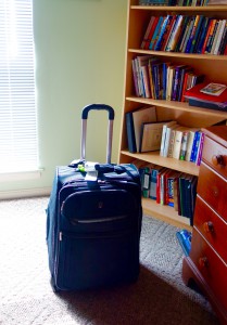 A suitcase in a guest room in Louisville, KY evokes the moment when a journey begins or ends. Image © Joyce McGreevy