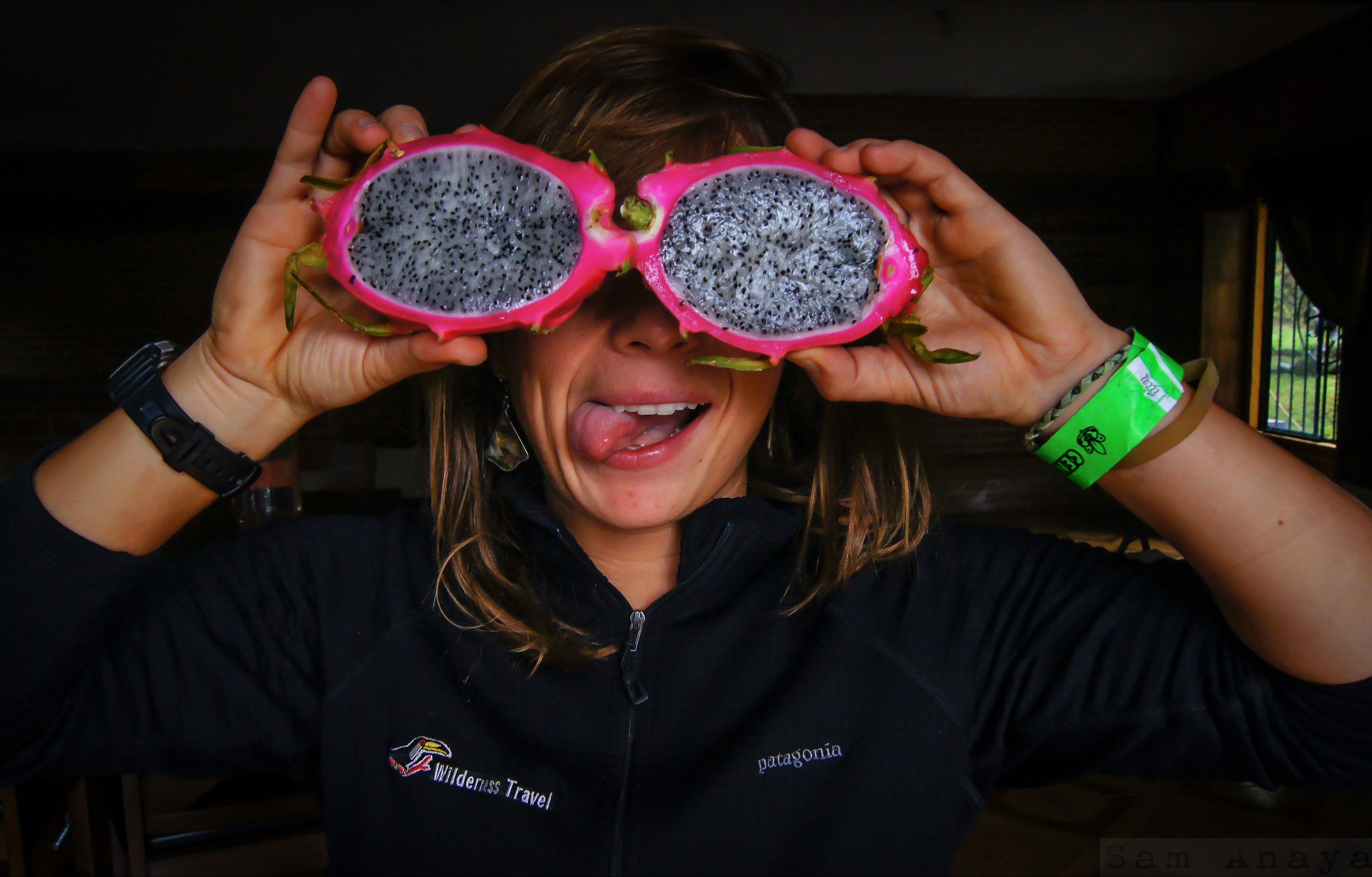 A girl holding a pitahaya fruit cut in half at the Central de Abasto, the world's largest wholesale market where Mexico's cultural heritage is also on display. (image © Sam Anaya A.)