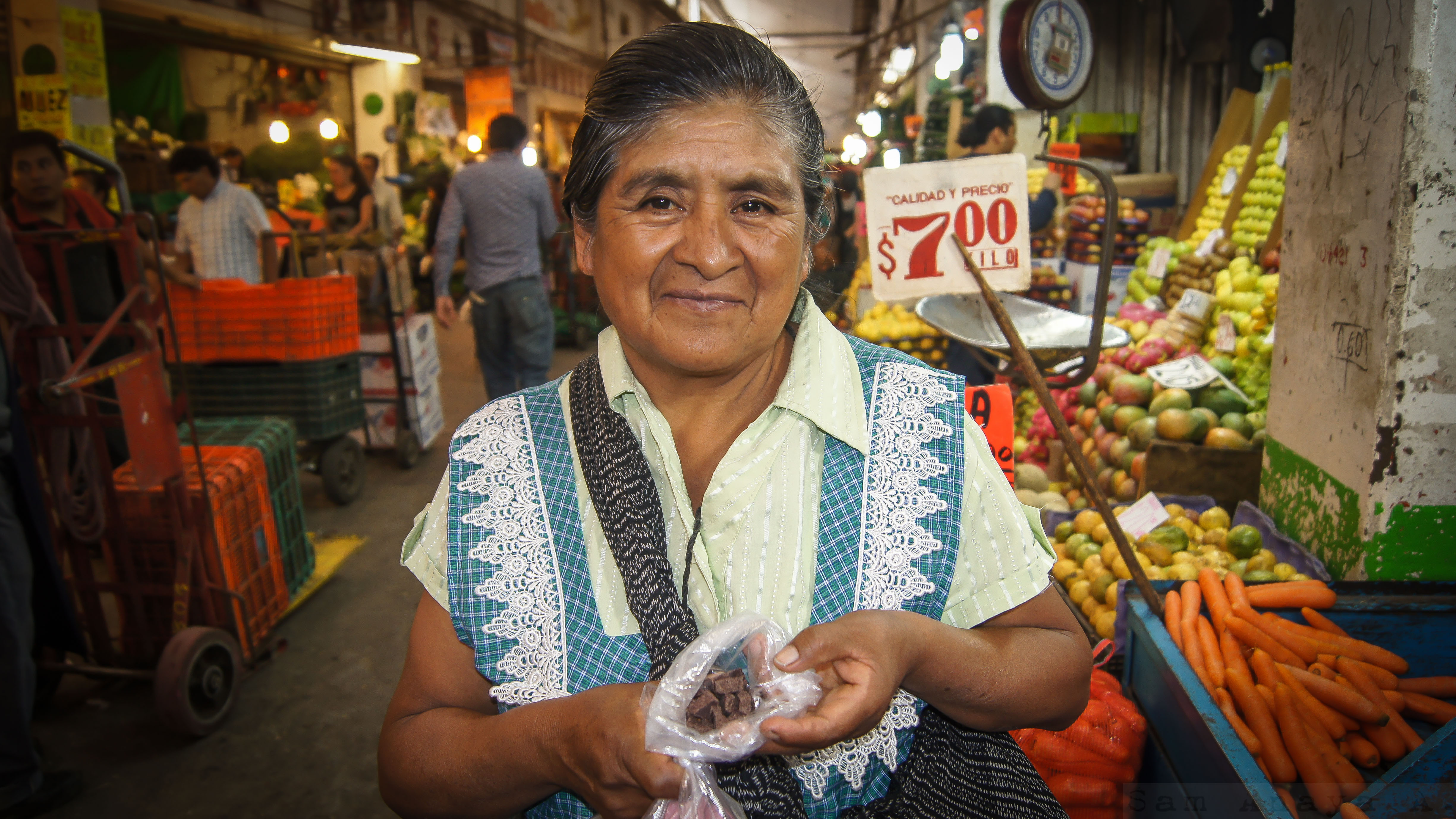 A woman selling chocolate at Central de Abasto, the world's largest wholesale market where Mexico's cultural heritage is also on display. (image © Sam Anaya A.)