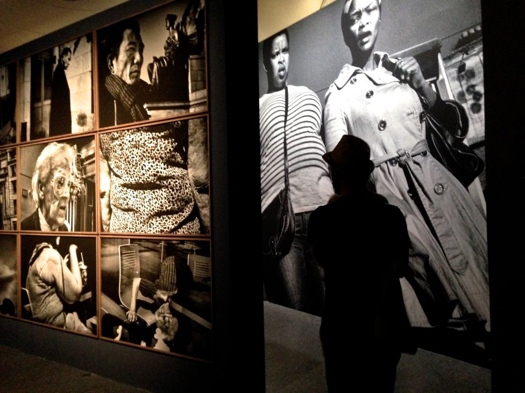 Visitor at Eamonn Doyle's exhibit at Rencontres d'Arles, a revelation for world photography. (Image © Meredith Mullins. Photographs © Eamonn Doyle.)