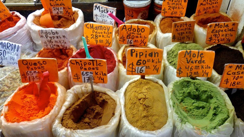 Bags filled with different spices at Central de Abasto, the world's largest wholesale market where Mexico's cultural heritage is also on display. (image© Eva Boynton)