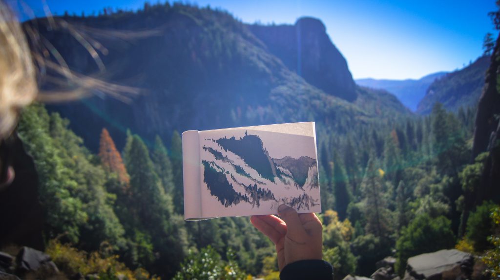 A drawing of Yosemite Valley in front of the drawn landscape, showing how a frame cannot open your eyes to really experience Yosemite. (image © Sam Anaya)