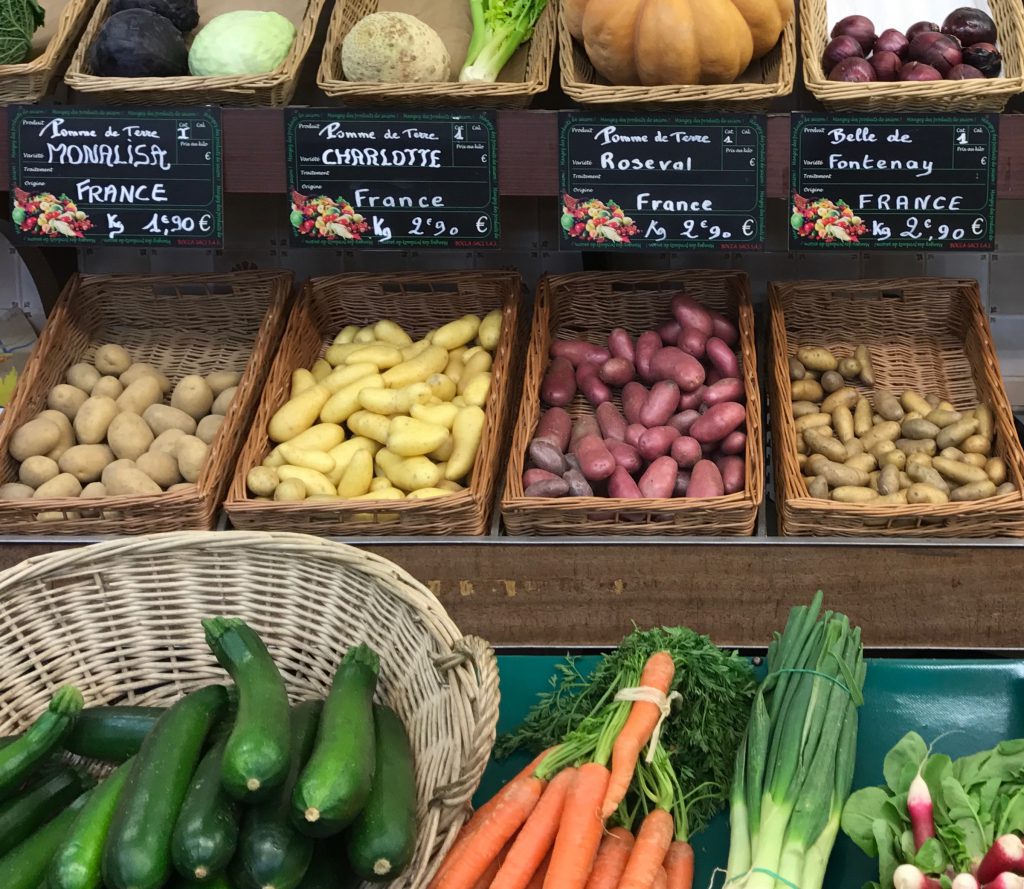 Potatoes on French market shelves, showing the cultural heritage of the potato in France. (Image © Meredith Mullins.)
