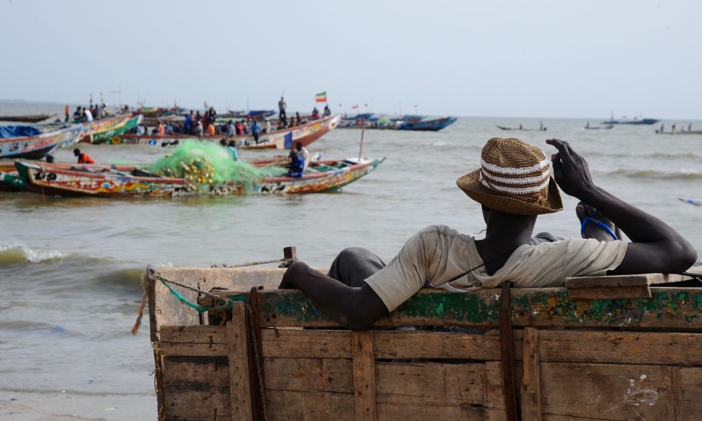 An ocean view of the fishing village of M'Bour Senegal, offering travel adventures and a photographer's dream of images. (Image © Meredith Mullins.)