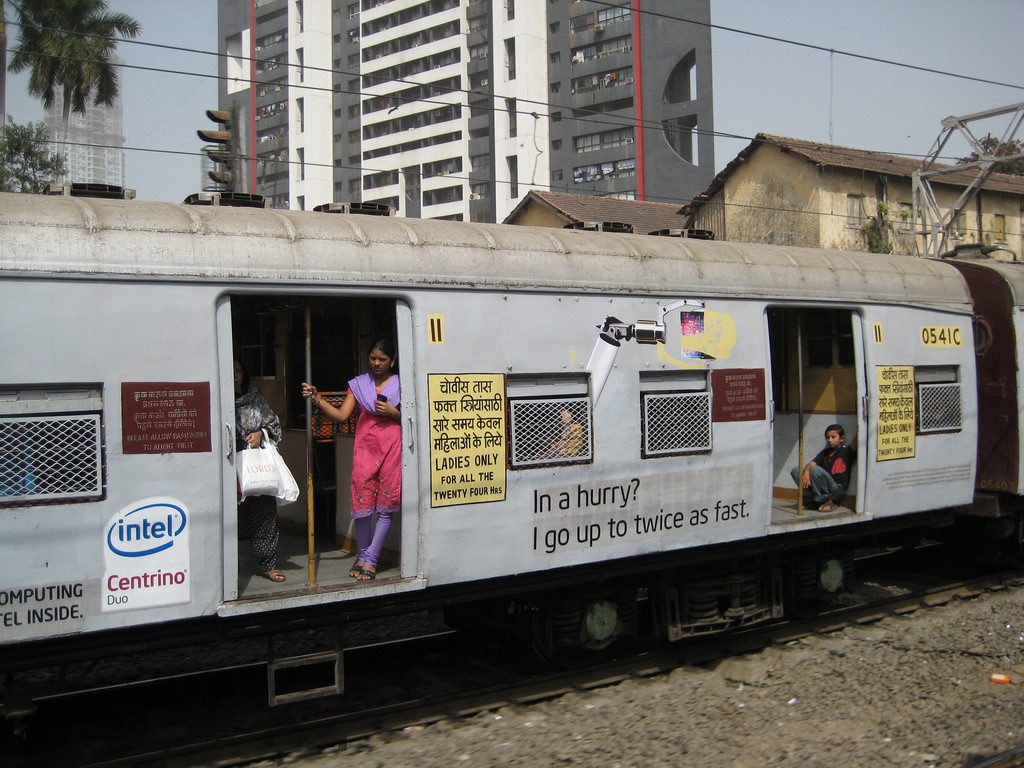 Women riding a women-only train in Mumbai, India, showing how pink transportation can advance women's rights and gender equality around the world (image © Madhav Pai).