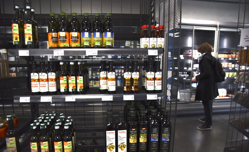 Shelf of olive oils at the Paris food co-op La Louve, an experiment in blending different cultures. (Image © Meredith Mullins.)