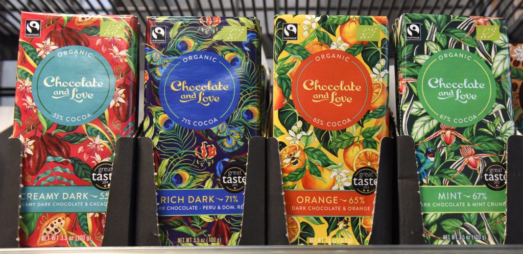 Shelf of chocolate bars at the Paris food co-op La Louve, an experiment in blending different cultures. (Image © Meredith Mullins.)