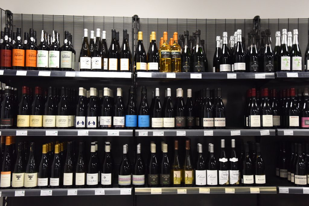 Wine shelf at the Paris food co-op La Louve, an experiment in blending different cultures. (Image © Meredith Mullins.)
