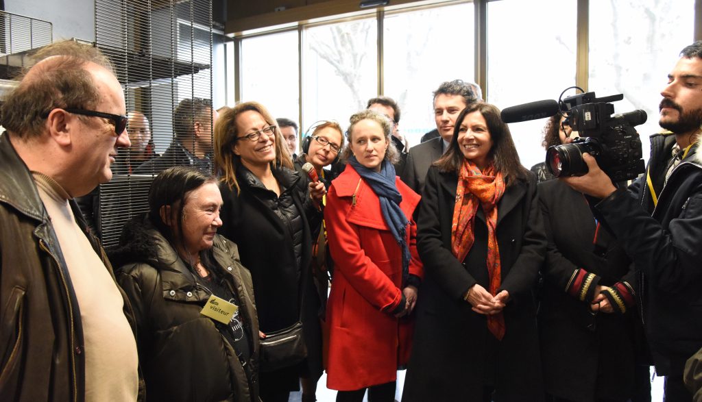 The mayor of Paris, Anne Hidalgo, talks with the diverse members of La Louve, the Paris food co-op that recognizes different cultures. (Image © Meredith Mullins.)