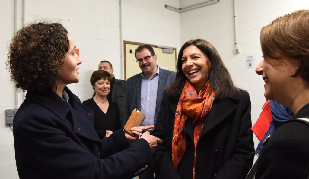 Paris Mayor Anne Hidalgo talks with members of the Paris food co-op La Louve, an experiment in the blending of different cultures. (Image © Meredith Mullins.)