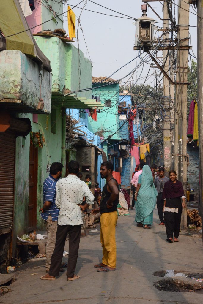 Colorful alley in the Kathputli Colony in Delhi, showing cultural encounters in the slums of India. (Image © Meredith Mullins.)