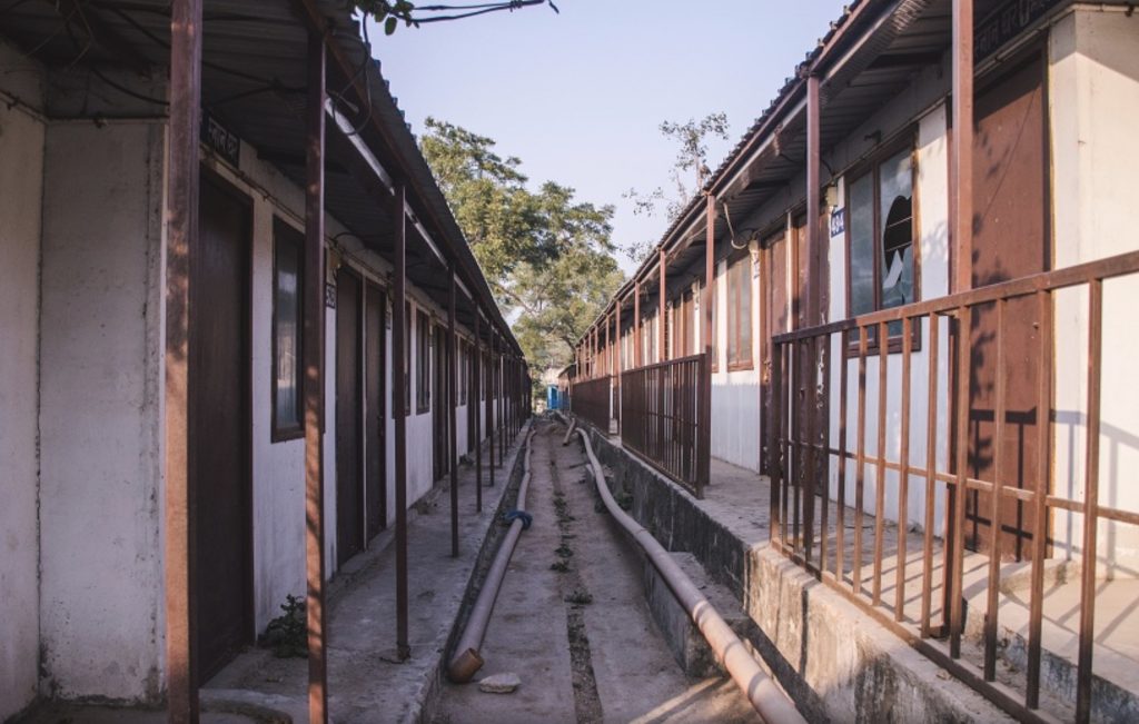 Two rows of transit camp units for the Kathputli Colony, showing how cultural encounters in the slums of India have led to displacement. (Image © Sanjuko Basu.)