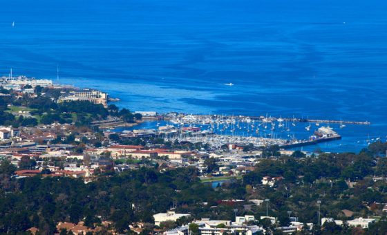 View of Monterey Bay, California, offering travel adventures and air travel stories to remember. (Image © Santalechuga/iStock.)