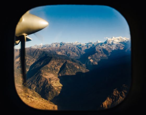 The Himalaya from a plane to Kathmandu Nepal, offering travel adventures and air travel stories for a lifetime. (Image © Dutourdemonde/iStock.)