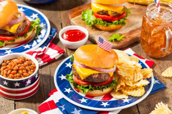 Fourth of July picnic, part of crossing cultures in celebration of Independence Day. (Image © iStock/bhofact2.)