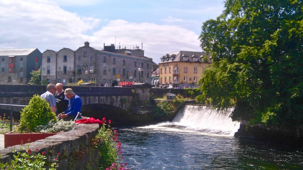  Galway's Corrib Riverbank is a gathering place for the conversations that are part of Ireland's cultural heritage. Image © Conall Stafford