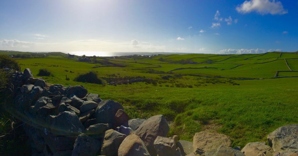 Ireland's green fields and stone walls feature in the songs that art part of Irish cultural heritage. Image © Joyce McGreevy