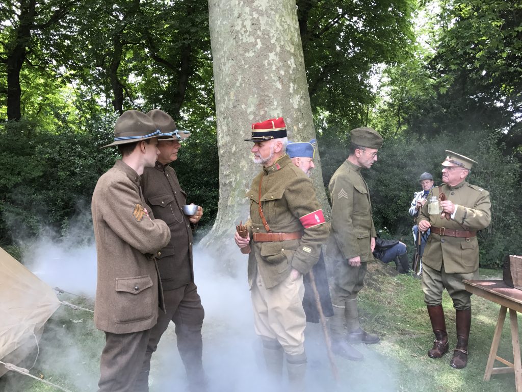 WWI soldiers at the American Embassy party in France, part of crossing cultures to celebrate Independence Day. (Image © Meredith Mullins.)