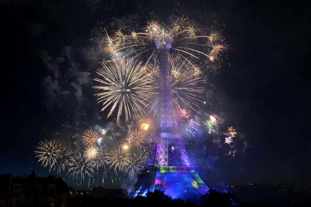 Fireworks at the Eiffel Tower on Bastille Day, part of crossing cultures in celebration of Independence Day. (Image © Meredith Mullins.)