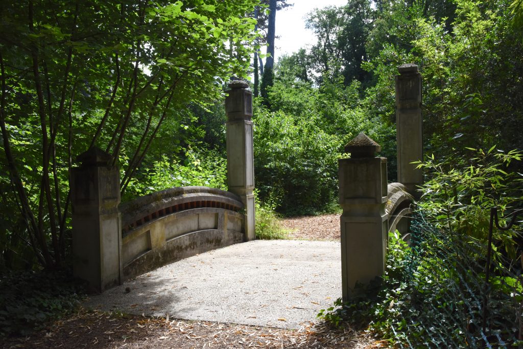 Bridge in the Jardin d'agronomie Tropicale, one of the hidden gardens in Paris where visitors can be traveling the world. (Image © Meredith Mullins.)