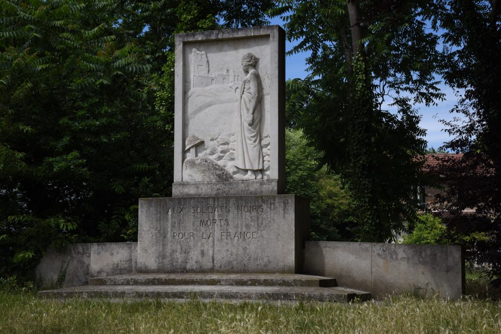 Memorial to black soldiers in the Jardin d'agronomie Tropicale, one of the hidden gardens of Paris where visitors can be traveling the world. (Image © Meredith Mullins.)