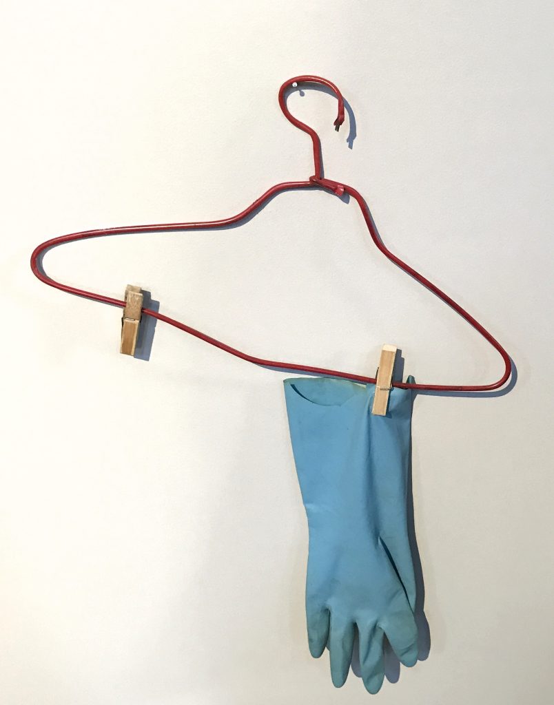 Hangar and gloves, found objects from Hong Kong alleyways, part of Michael Wolf's Informal Solutions series at the Rencontres d'Arles photography festival, crossing cultures to show life in cities. (Image © Meredith Mullins/Installation © Michale Wolf.)