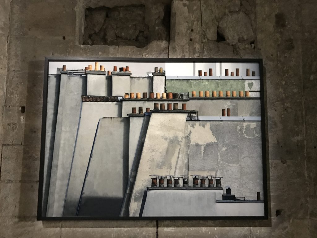 Paris rooftops, part of Michael Wolf's exhibit at the Rencontres d'Arles, crossing cultures to show life in cities. (Image © Meredith Mullins.)
