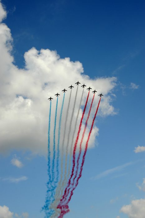 Jets trailing blue, white, and red of the French flag on Bastille Day, part of crossing cultures in celebration of Independence Day. (Image © Meredith Mullins.)