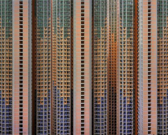 Pink toned high rise apartment building, part of Michael Wolf's series Life in Cities, images that are crossing cultures to show urban life. (Image © Michael Wolf.)
