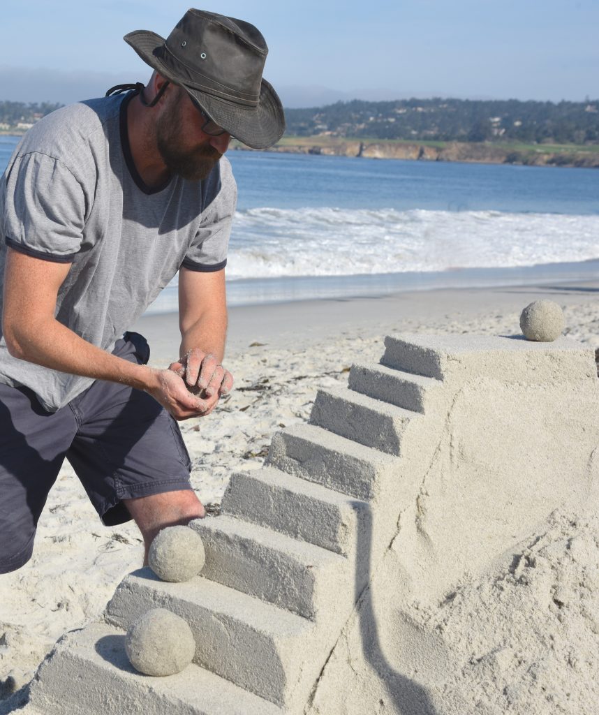 Todd Weaver makes a sand sculpture at the Great Carmel Sand Castle Contest, discovering the art of sand sculptures. (Image © Meredith Mullins.)