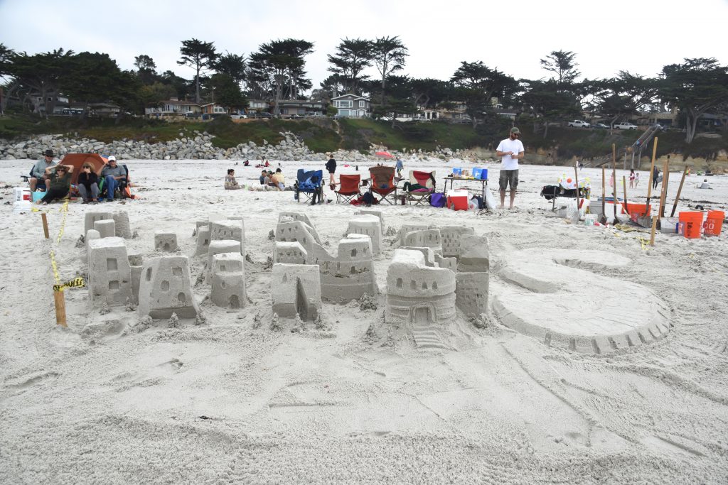 Sand sculpture that spells out LINES for the Great Carmel Sand Castle Contest, discovering the art of sand sculpting. (Image © Meredith Mullins.)