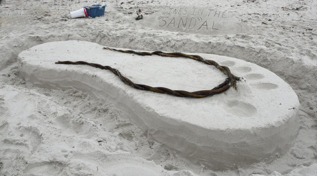 A sandal sand sculpture at the Great Carmel Sand Castle Contest, where entrants discover the art of sand sculptures. (Image © Meredith Mullins.)