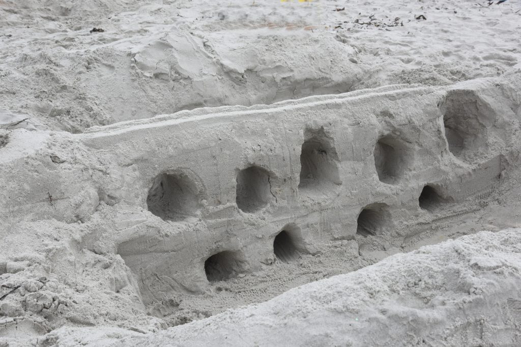 A sand sculpture aqueduct at the Great Carmel Sand Castle Contest, where entrants discover the art of sand sculptures. (Image © Meredith Mullins.)