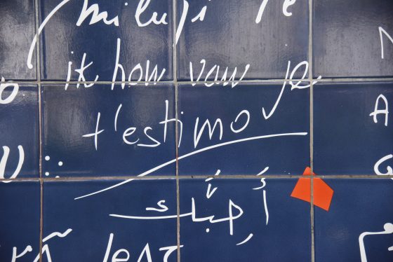 Part of the Wall of Love in Montmartre Paris, showing many ways to say I love you in different languages. (Image © Meredith Mullins.)