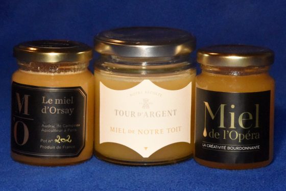 Three jars of Paris honey, from the Musée d'Orsay, the Tour d'Argent, and Opera Garnier, discovering nature via urban beekeeping and Paris honey. (Image © Meredith Mullins.)