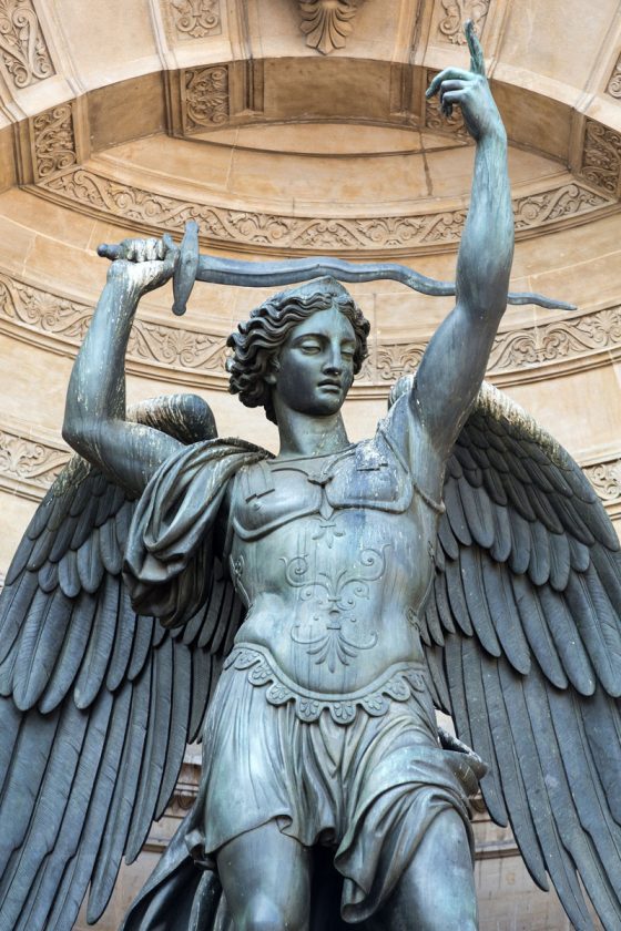 The archangel Michael in the Place de St Michel fountain in Paris, one of the Paris angels who serve as a cultural symbol. (Image © wjarek/iStock.)