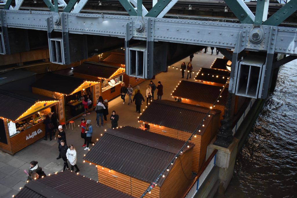 Pop-up shops under Millennium Bridge in London inspire wanderlust for an English holiday ramble. (Image © Joyce McGreevy)