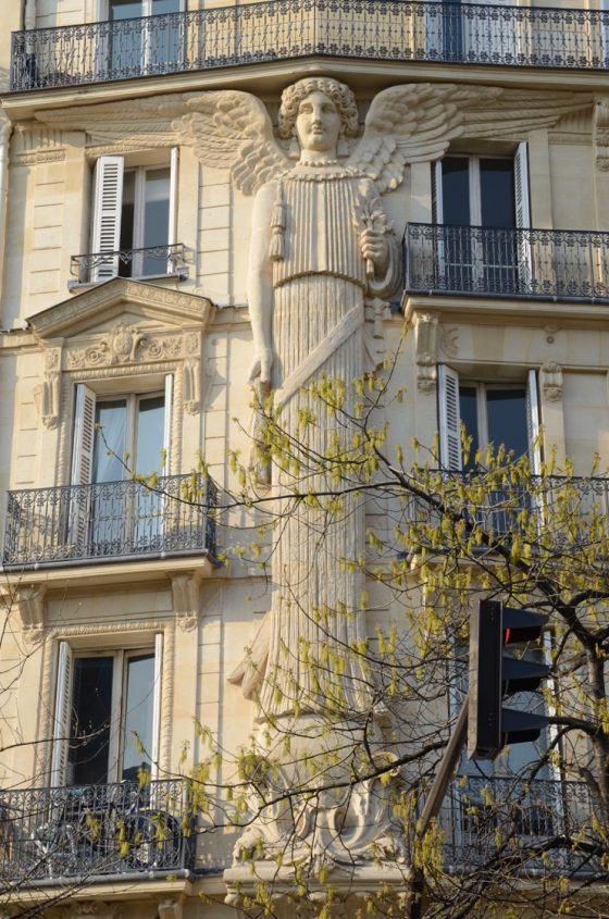 A tall angel on Rue Turbigo, one of the Paris angels that serve as cultural symbols. (Image © Rosemary Flannery.)