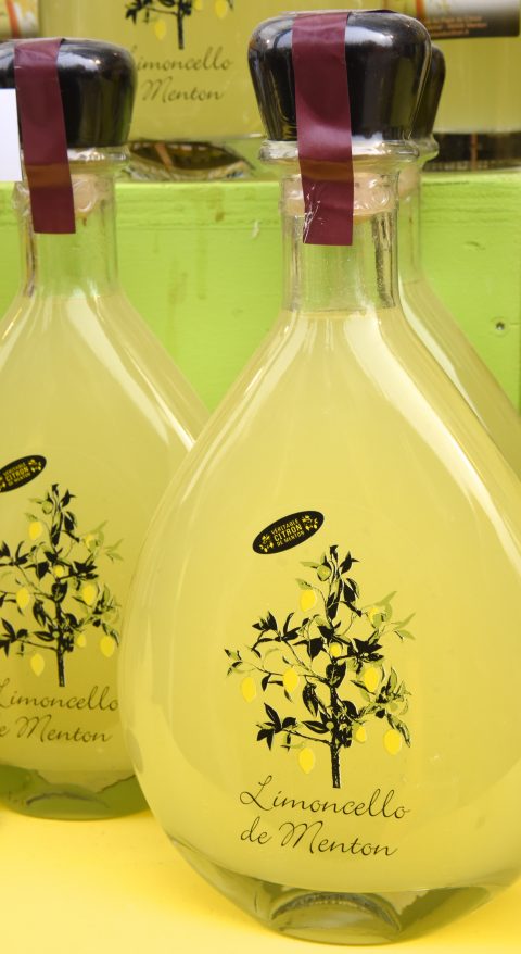 Bottles of limoncello, travel inspiration to visit the Menton Lemon Festival. (Image © Meredith Mullins.)