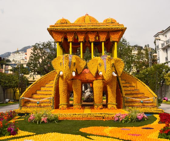 An elephant temple made of lemons and oranges, part of the Menton Lemon Festival that provides travel inspiration to learn about lemons and India. (Image © Meredith Mullins.)