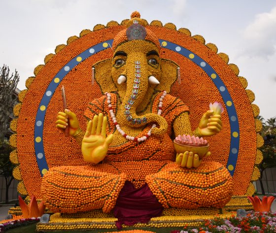 The Indian god Ganesh made of lemons and oranges at the Menton Lemon Festival, travel inspiration for unusual events. (Image © Meredith Mullins.)