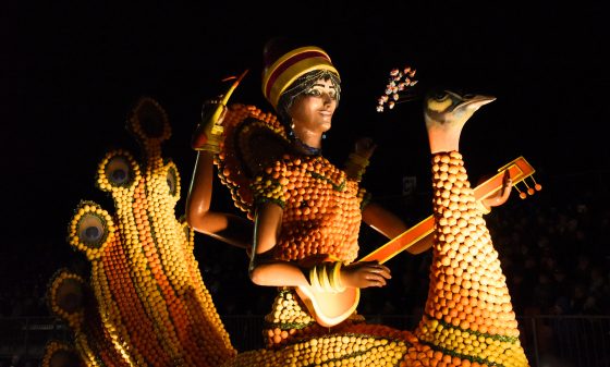 Hindu goddess Saraswati at the night parade of the Menton Lemon Festival, travel inspiration for unusual events. (Image © Meredith Mullins.)