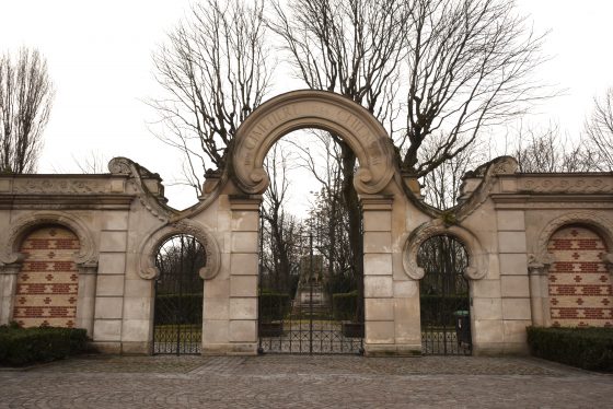 Gates to the Paris pet cemetery, showing cultural traditions for saying farewell to pets. (Image © Meredith Mullins.)