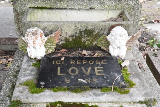 Tombstone honoring Love at the Paris pet cemetery, showing cultural traditions related to pet lovers' farewell to their pets. (Image © Meredith Mullins.)