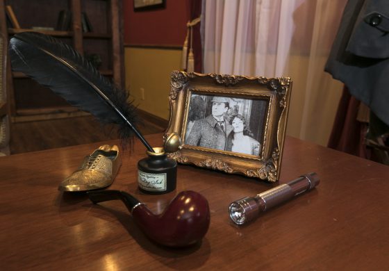 Sherlock Holmes items on a desk in the Exodus escape room in Monterey, California, one of the escape rooms around the world that offers cultural encounters and life lessons. (Image © Richard Green/Exodus Escape Room.)
