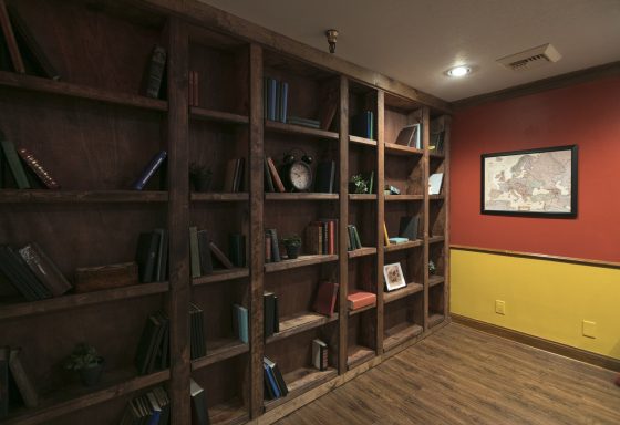 Bookshelf in the Exodus Escape Room in Monterey, California, one of the escape rooms around the world that offers cultural encounters and life lessons. (Image © Richard Green/Exodus Escape Room.)