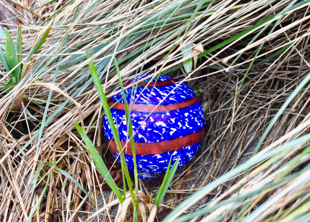 A handmade glass float placed on the Lincoln City beach for Finders Keepers reflects a cultural tradition of the Oregon coast. (Image © Joyce McGreevy)