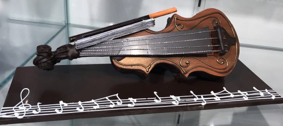 Chocolate violin from Josephine Vannier, showing cultural traditions of chocolate and the cocoa bean and fun facts about chocolate. (Image © Meredith Mullins.)